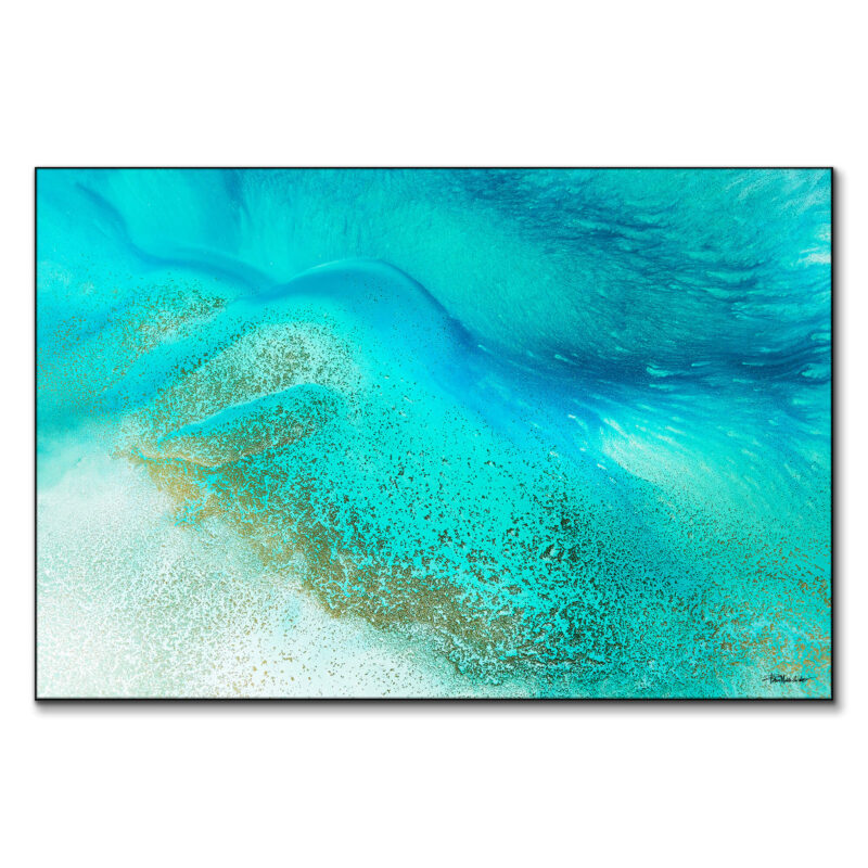 Tropical blue sea water meeting the shore with calming blue and white hues.