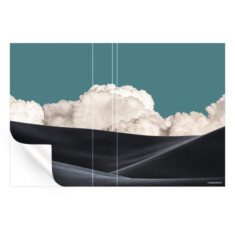 Surreal landscape with black sand dunes and dramatic clouds against a teal sky.