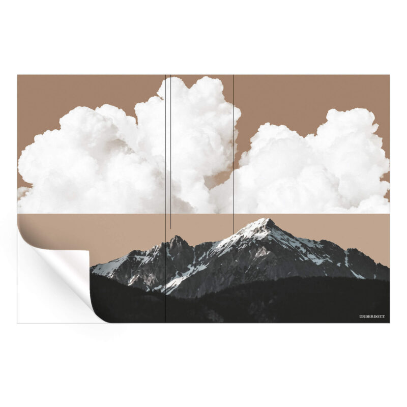 Mountain landscape with a soft tan sky, white clouds, and dark forested peaks, creating a peaceful yet dramatic natural scene.