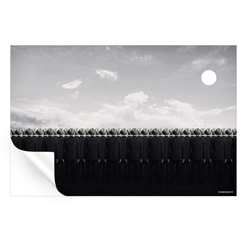 Surreal men in black suits standing in uniform against a white sky with a large moon, evoking a sense of mystery and eerie symmetry.