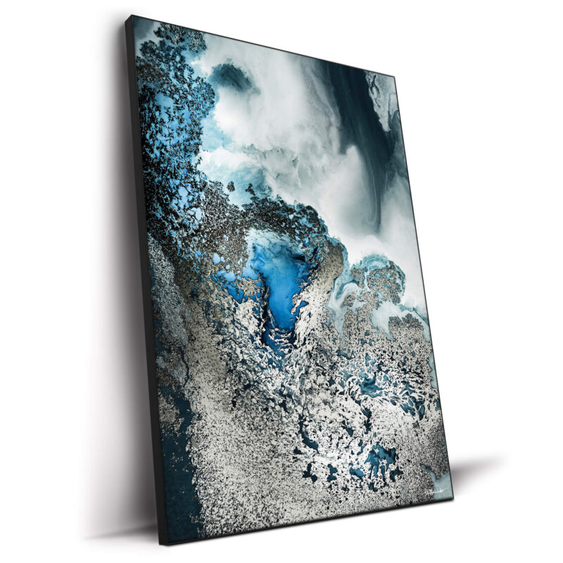 Abstract artwork featuring deep blue, silver, and black tones with intricate textures and fluid movement.